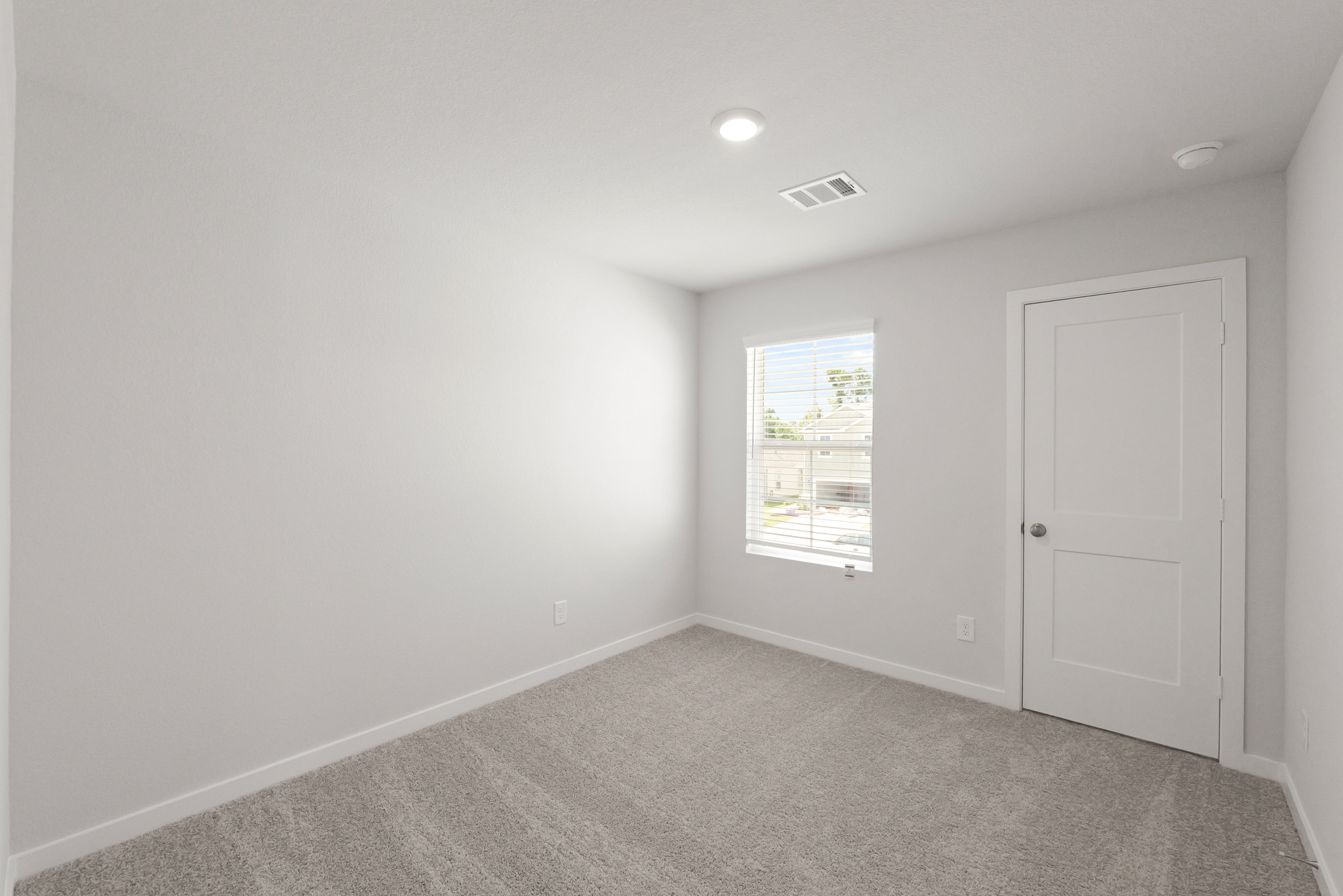 A room with a door and a window.