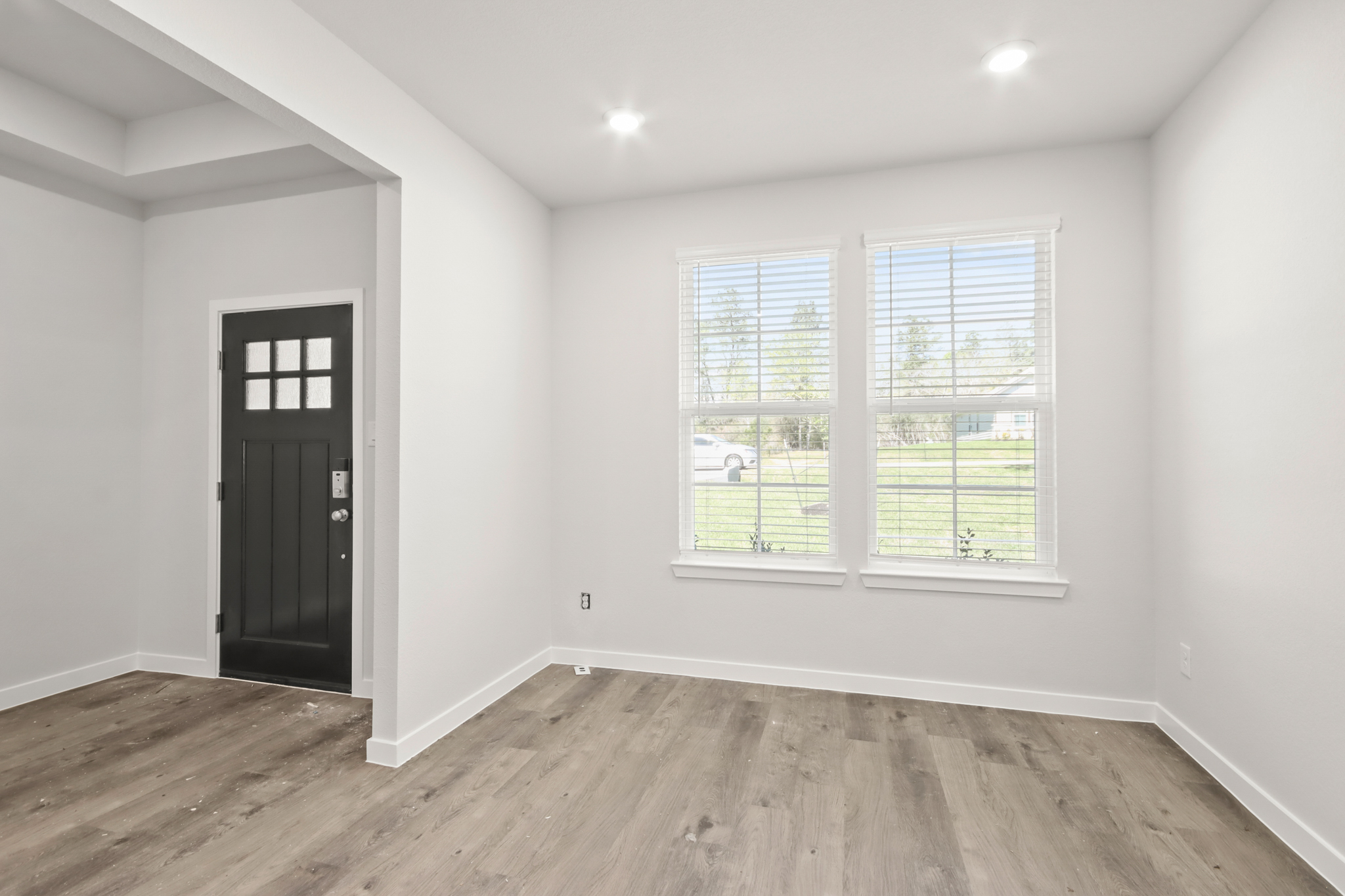 A room with a door and windows.