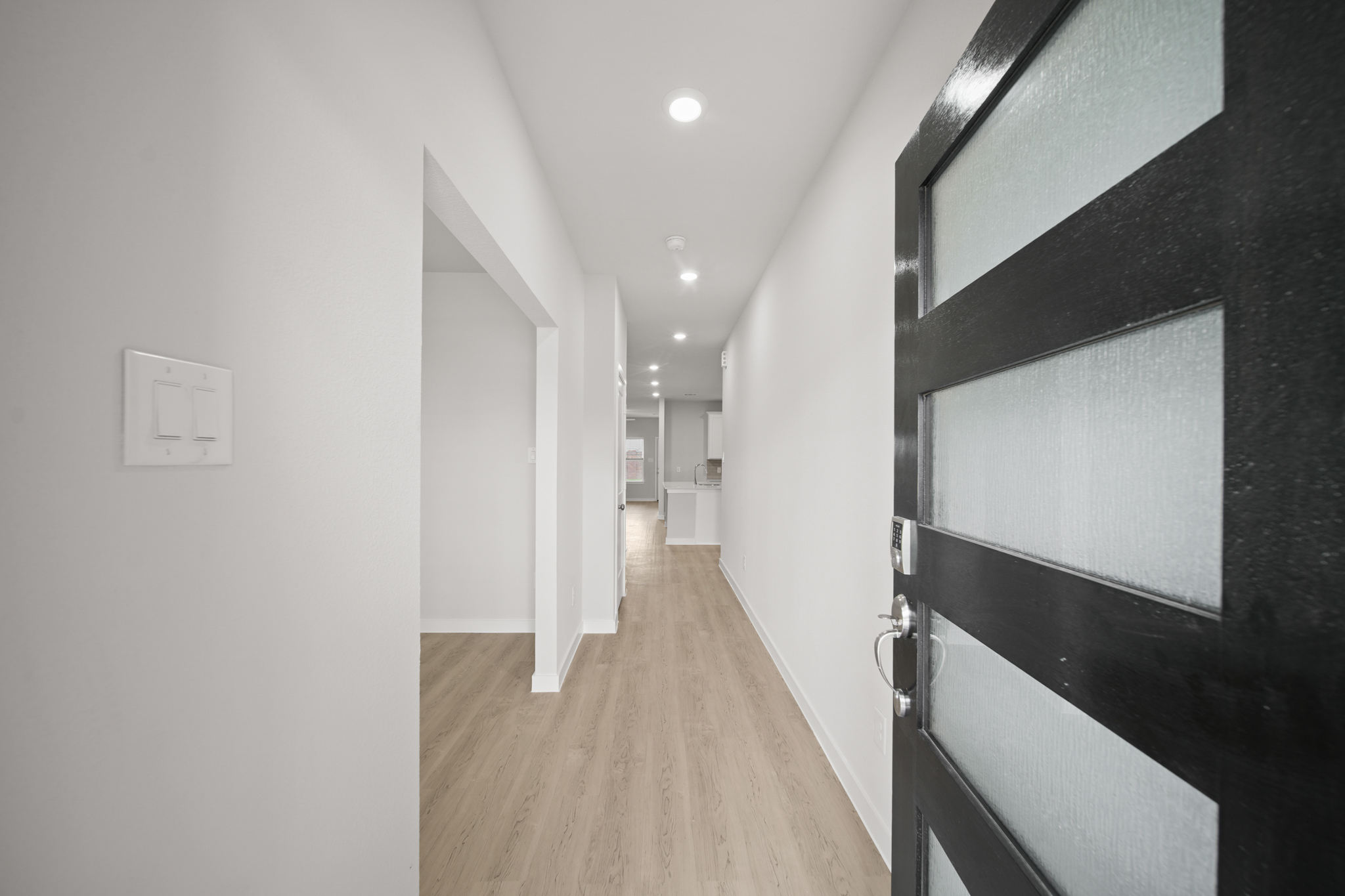 A hallway with black walls.