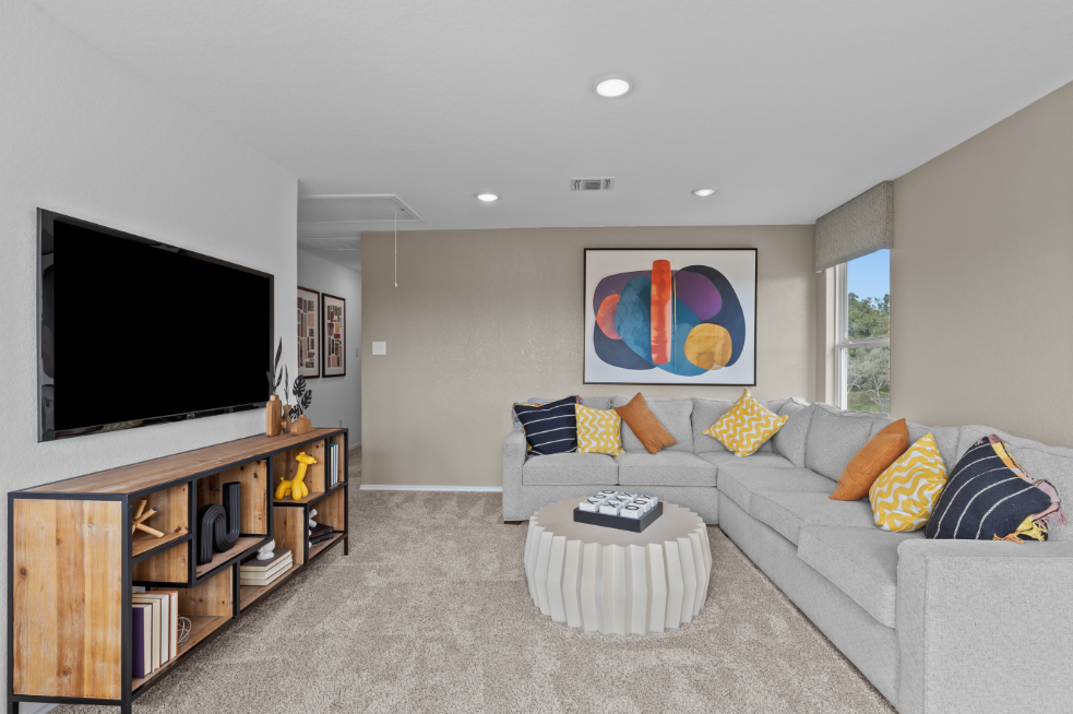 A living room with a tv and couches.