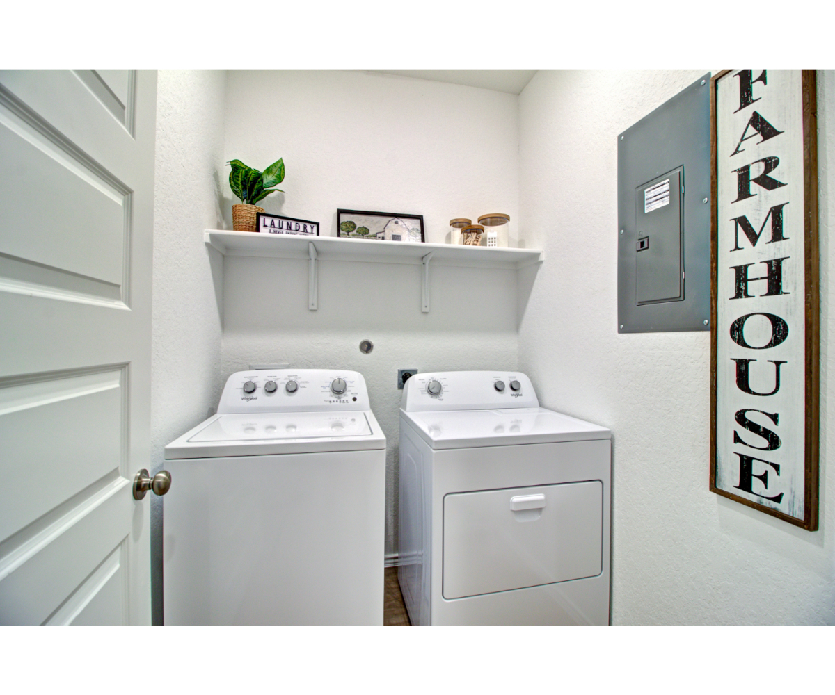 A laundry room with a washer and dryer.
