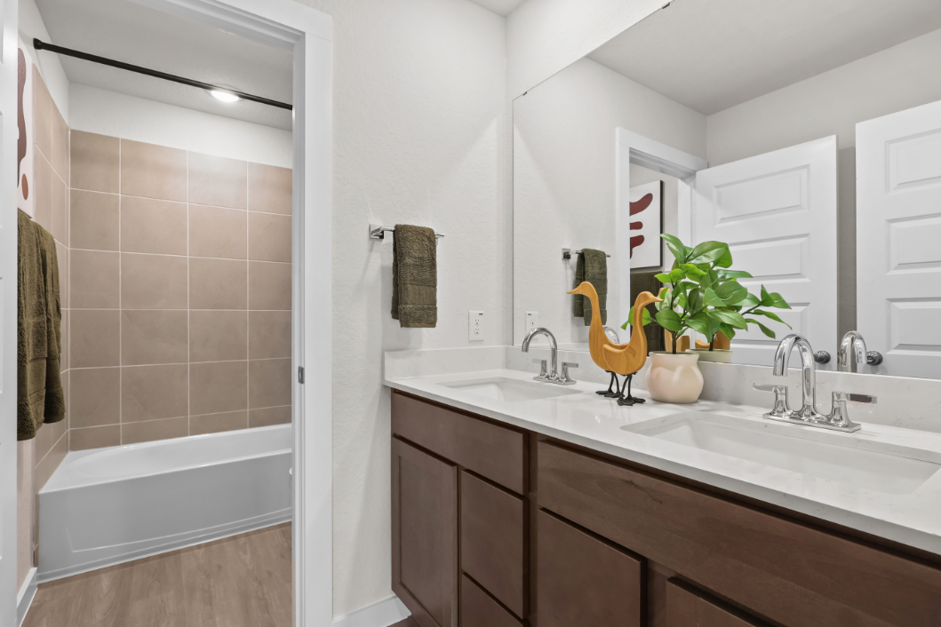 A bathroom with a sink and a bathtub.