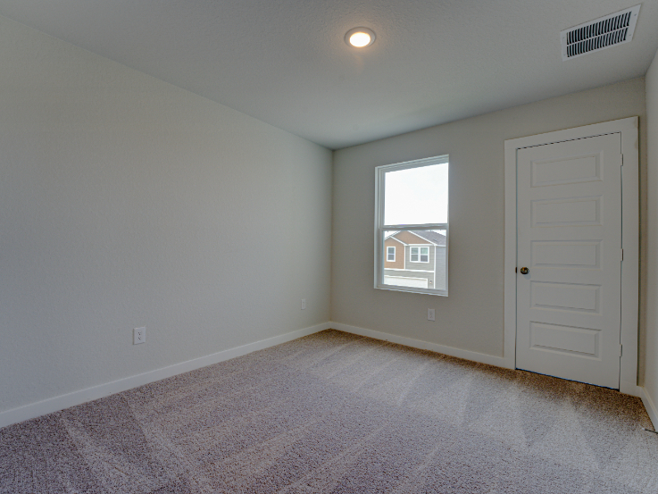 A room with a door and a window.