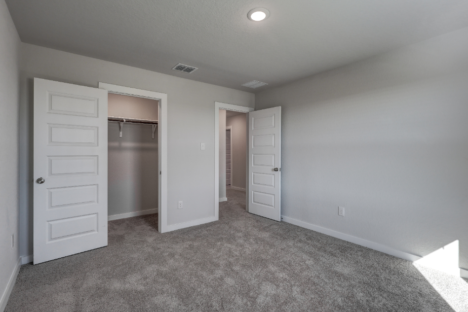 A room with white cabinets.