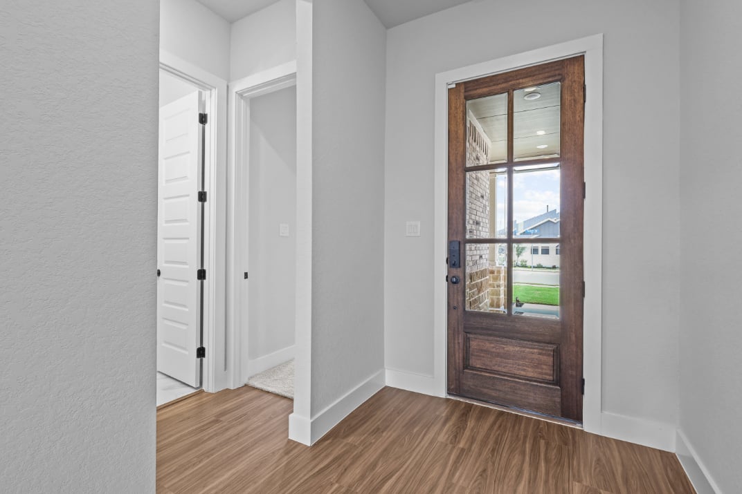 A room with a door and a window.