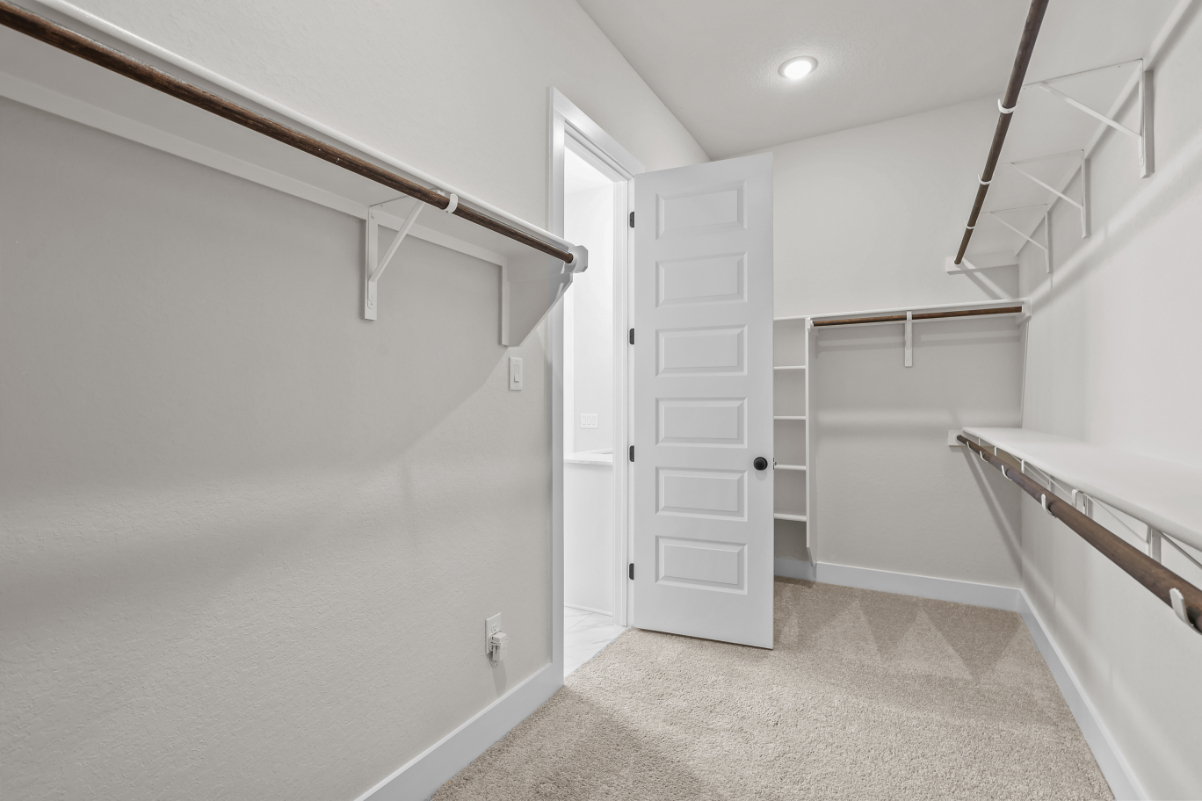 A white room with a white door.