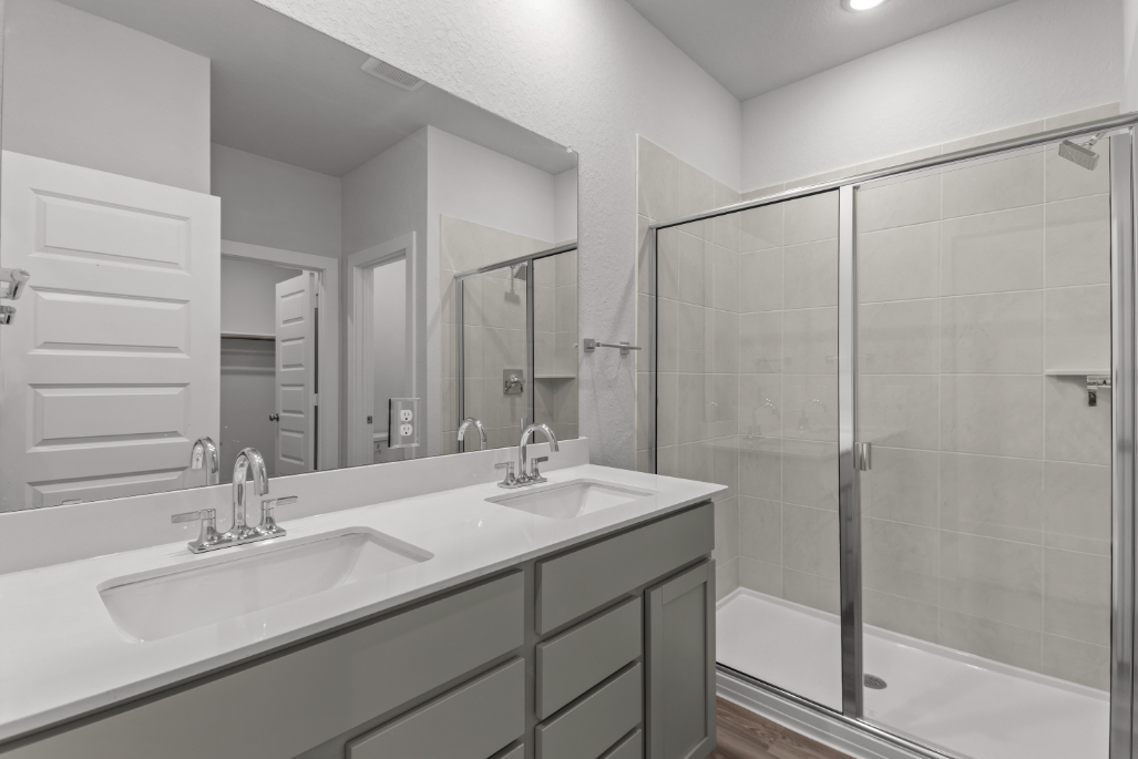 A bathroom with a glass shower.