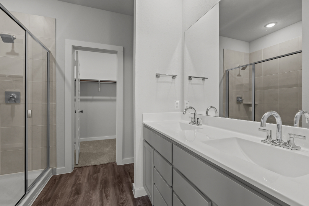 A bathroom with a glass shower.