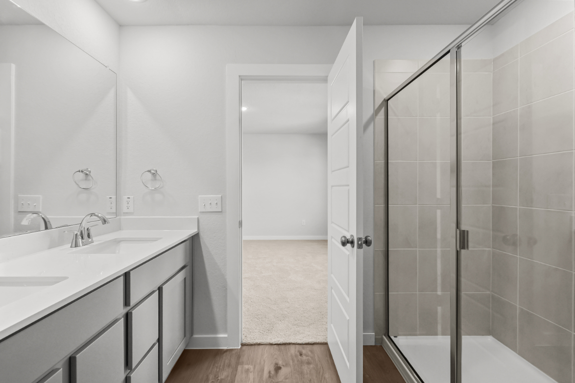 A bathroom with a glass shower.