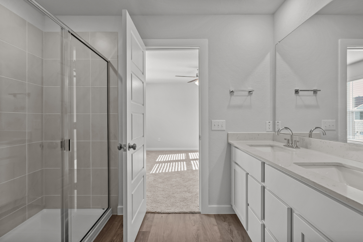 A bathroom with a glass shower.