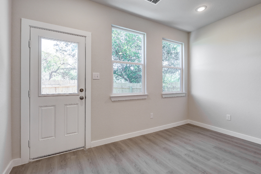 A room with a door and windows.