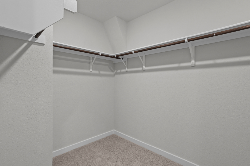 A white staircase in a room.