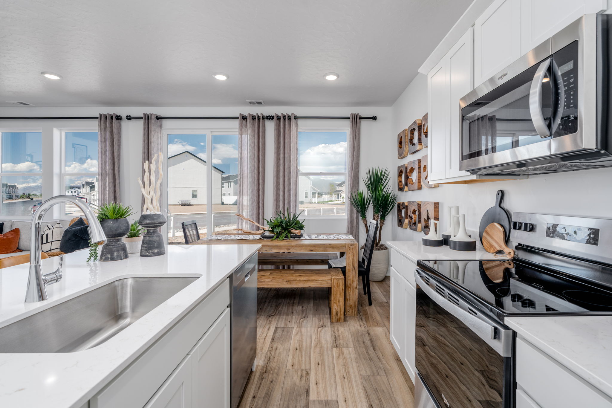 A kitchen with a large window.