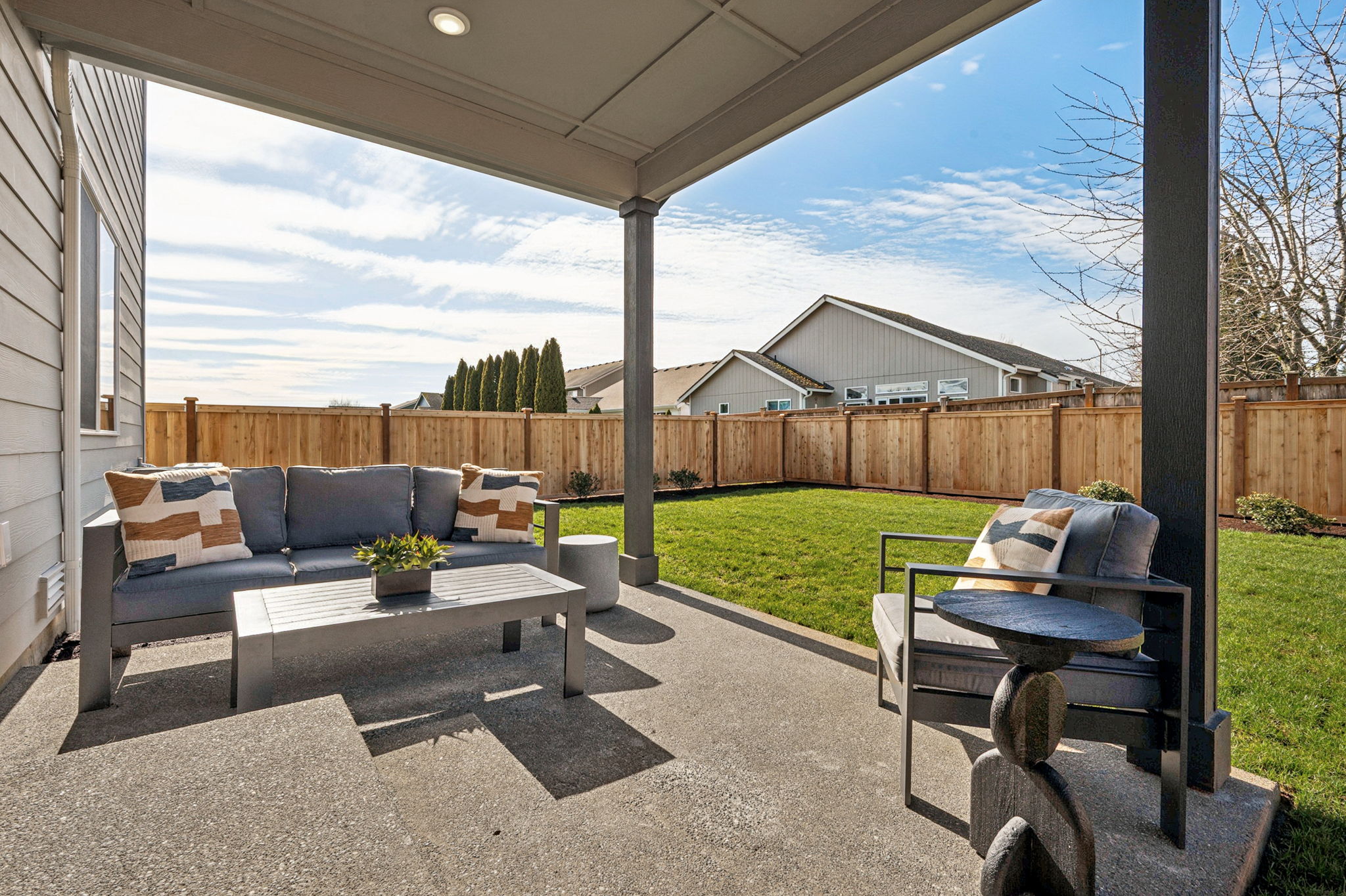 A patio with a table and chairs.