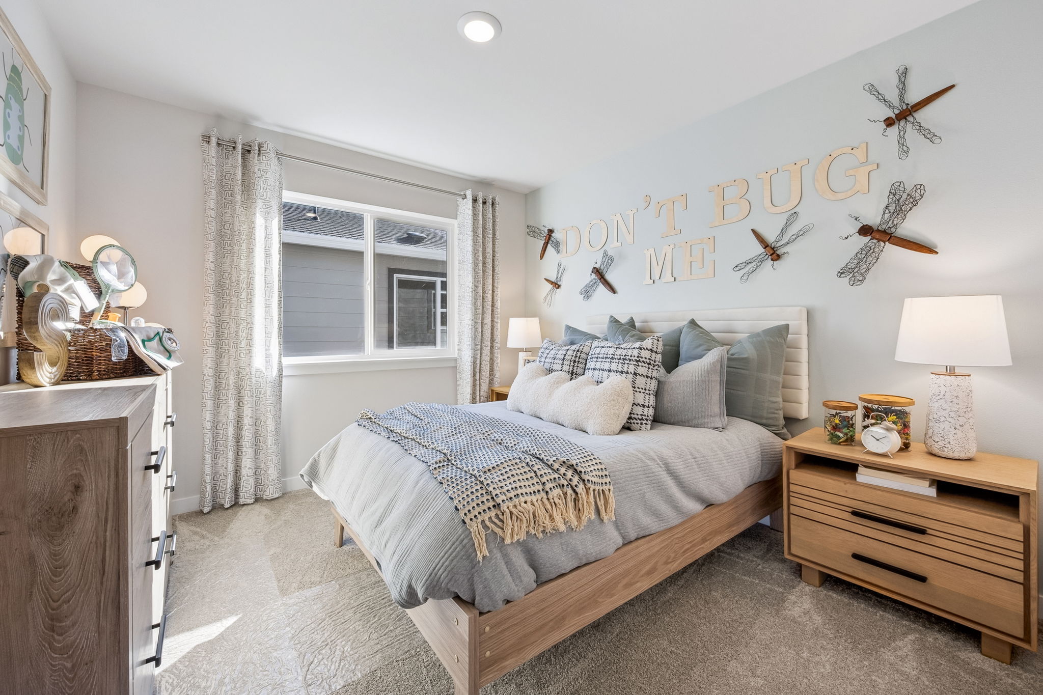 A bedroom with a bed and a window.