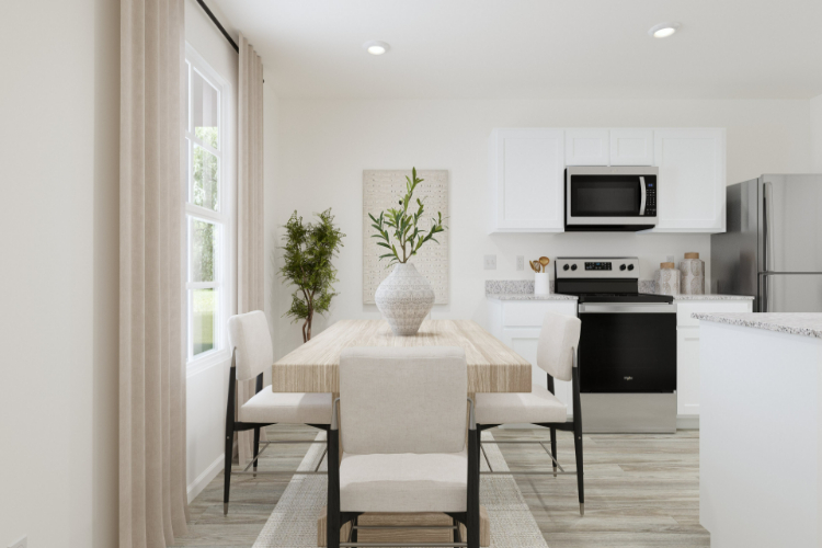 A kitchen with a dining table and chairs.