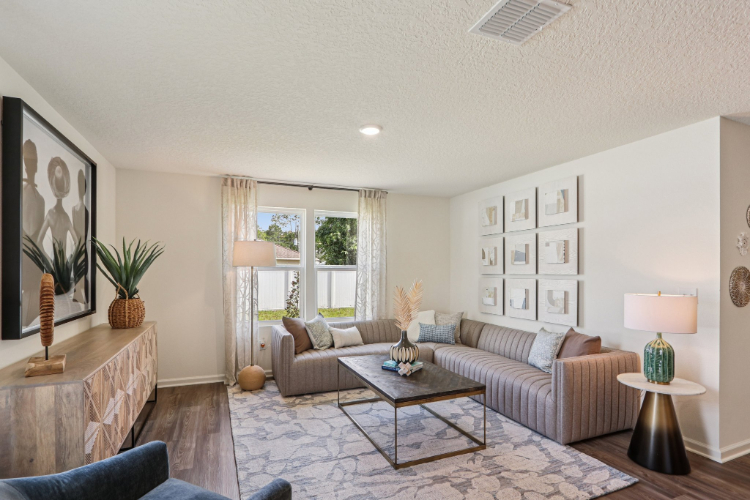 A living room with a couch and a coffee table.
