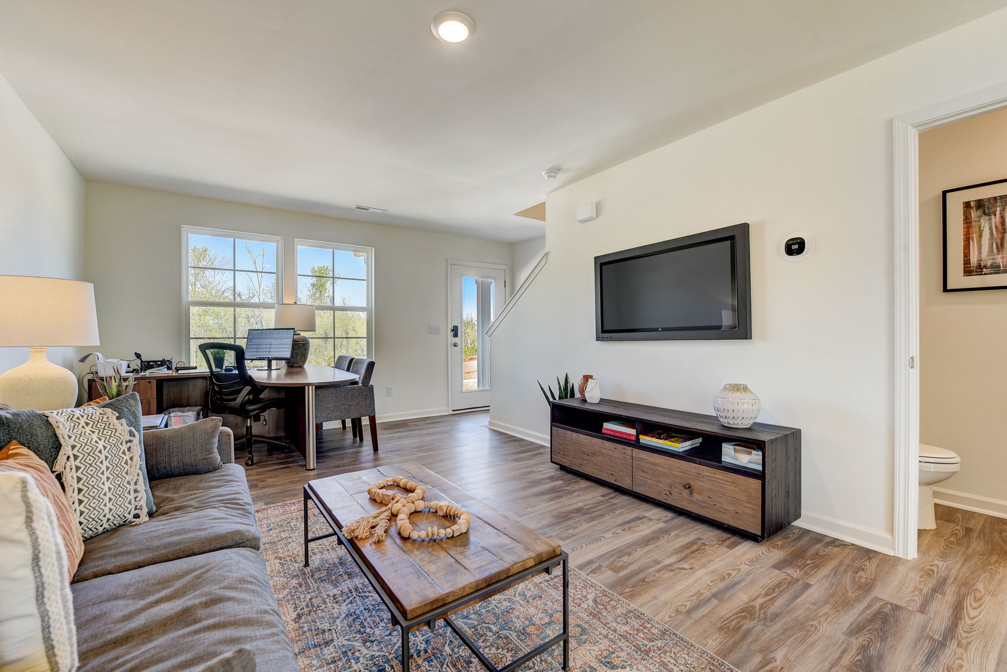 A living room with a tv and couches.