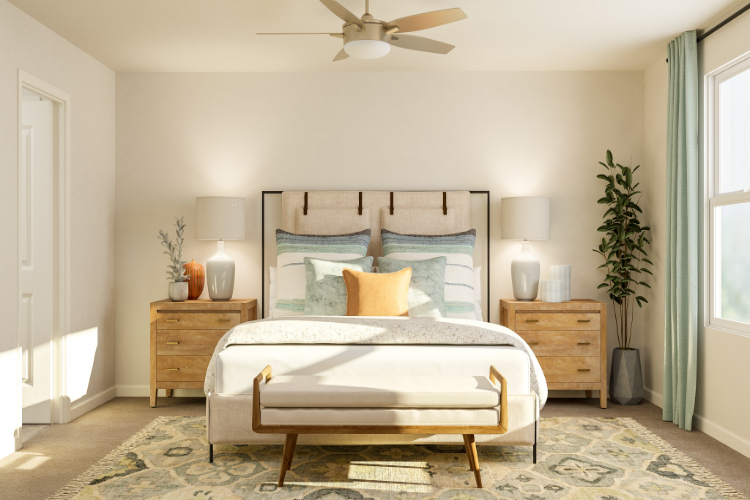 A bedroom with a bed and lamps.