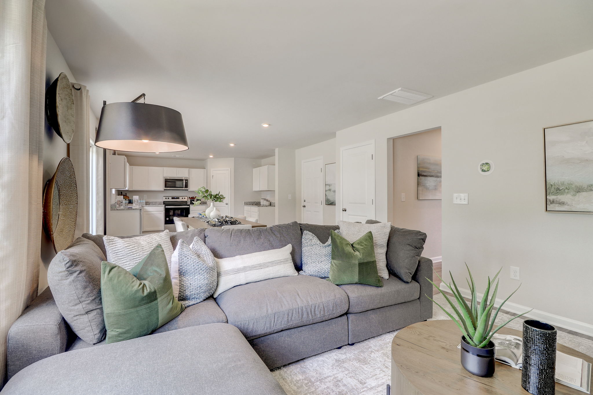 A living room with a couch and a table.