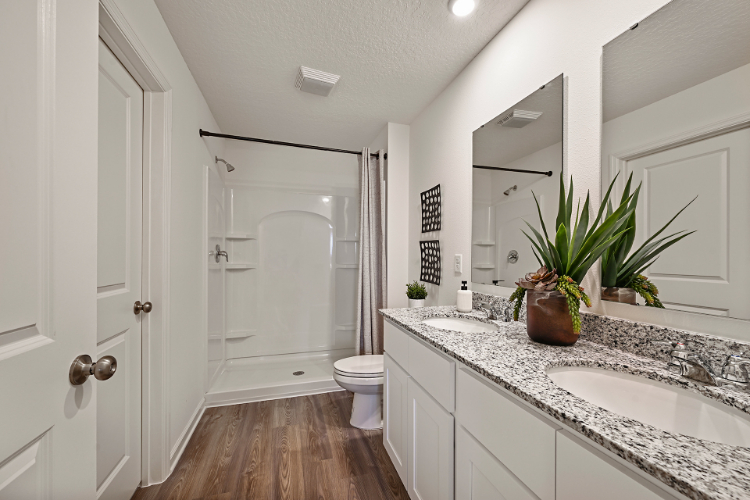 A bathroom with a marble countertop.
